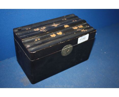A black lacquered Tea Caddy with gold coloured decoration.