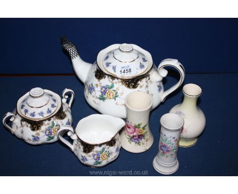 A Royal Albert 'Duchess teapot, sugar bowl and milk jug together with three bud vases including Palissey