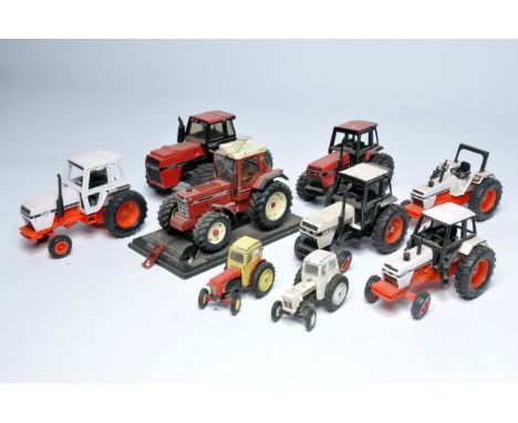 A group of mostly Ertl 1/32 Case Tractor issues plus a Wagenhoff 1/32 1455XL International Tractor. The latter issue is damag