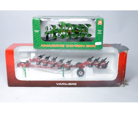 Universal Hobbies Duo of 1/32 farm model issues comprising Amazone Cayron 6 furrow plough plus Gregoire Besson 8 Furrow 'Vari