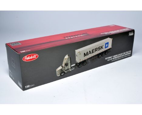 Diecast Masters 1/50 model truck issue comprising Peterbilt 579 Day Cab Tractor with 40' Refrigerated Sea Container. Looks to