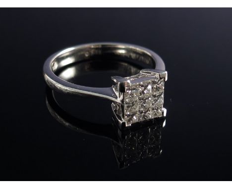 An 18ct white gold diamond ring the nine square cut diamonds in square four claw setting 