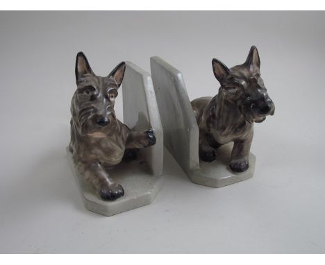 A pair of ceramic "Goldscheider" bookends in the form of dogs