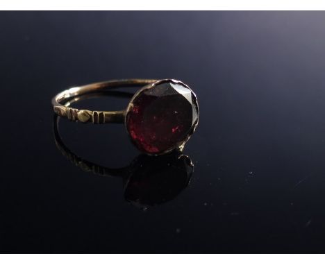 A 19th Century garnet ring, closed back setting