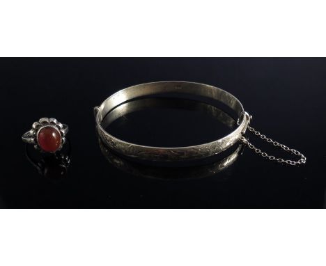 A silver bangle and a cabochon ring (2)