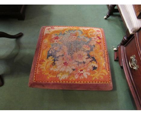 A circa 1840 sarcophagus shaped mahogany footstool, the upholstered seat over brass bun feet  