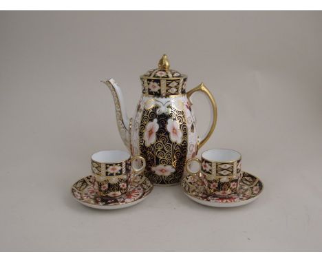 A Royal Crown Derby coffee set with six coffee cans and saucers (lid to coffee pot stuck)