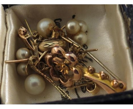 A collection of stud earrings including gold and pearl examples and a silver napkin ring 