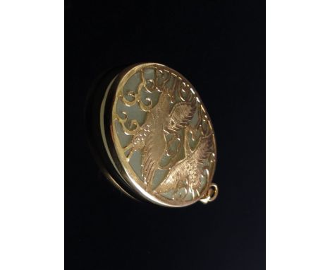 A jade and yellow metal pendant, bird design