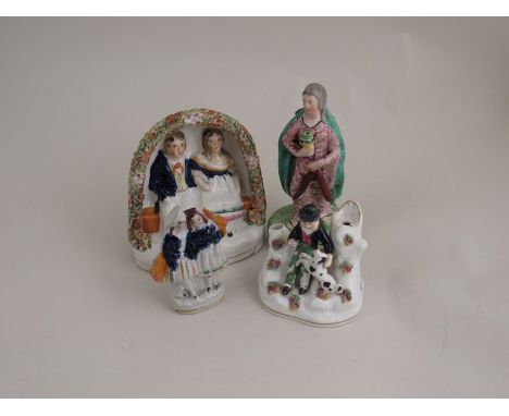 A group of four assorted ceramic figures including 18th Century example of lady, man and woman on bench etc a/f