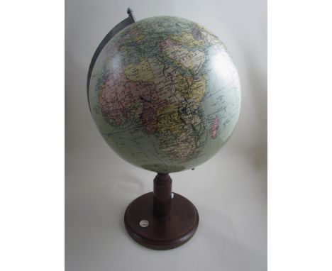 A mid 20th Century world globe on chrome and wooden base with compass, 53.5cm tall