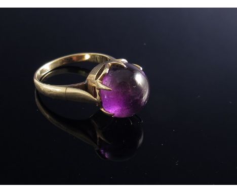 A ring set with large cabochon amethyst 