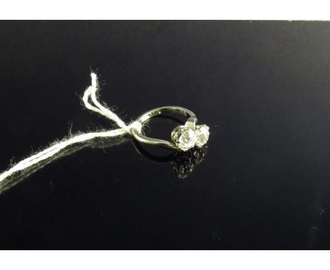 A two stone diamond ring the 1ct and .75ct diamonds (approx) in cross over setting 