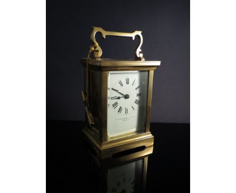 A brass goldsmiths and silversmiths of London carriage clock with key