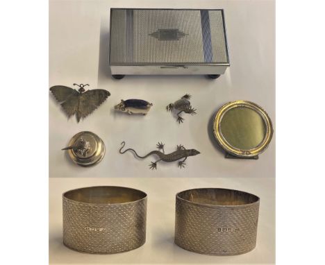 A pair of silver engine turned napkin rings Birmingham 1943, a silver photograph frame Birmingham 1923 and other wares