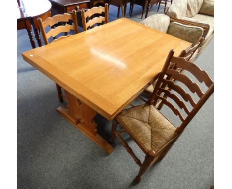 A light oak drawer leaf table, 213 cm long extended, 91 cm wide, together with a set four oak leatherback chairs with rush se