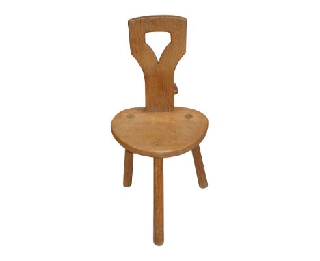 Robert 'Mouseman' Thompson of Kilburn. (1876-1955) An oak spinning chair c.1970the shaped back pierced back over a rounded ad