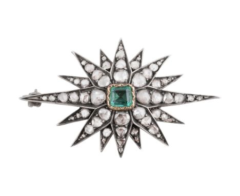 A late Georgian emerald and diamond-set star broochthe central rectangular step-cut emerald within a wavy yellow gold collet 