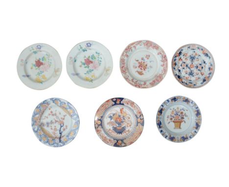 Seven 18th century Chinese export porcelain platescomprising a pair of famille rose plates painted to centre with sprays of p