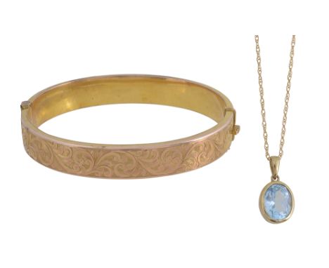 A topaz pendantbezel set oval mix-cut blue topaz suspended on a fine fancy-link chain, stamped to suspension loop '375"   tog