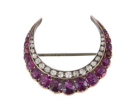 A mid Victorian ruby and diamond-set crescent broochset with a tapering line of graduated mixed-cut rubies to the inner line 