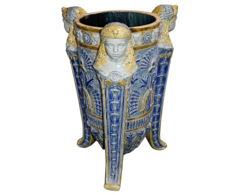 A late 19th century English Egyptian Revival stoneware jardiniere or stick standthe tapering body decorated in relief with Eg