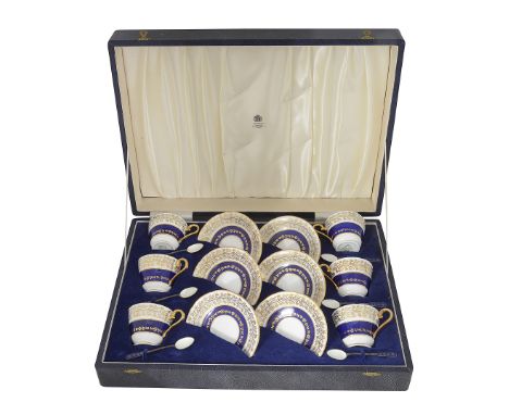 A cased Aynsley set of six coffee cups and silver and enamel spoonsdecorated in pattern 2493 and accompanied by six Danish El