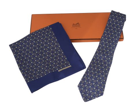 An Hermes silk tie and matching handkerchief setnavy silk tie and handkerchief with beige and light blue ring pattern, contai