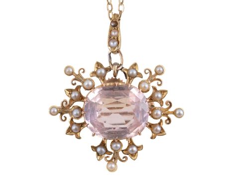 An Edwardian pink topaz and seed pearl brooch/pendantthe central pink topaz  claw-set above the openwork scrolling and fleur 