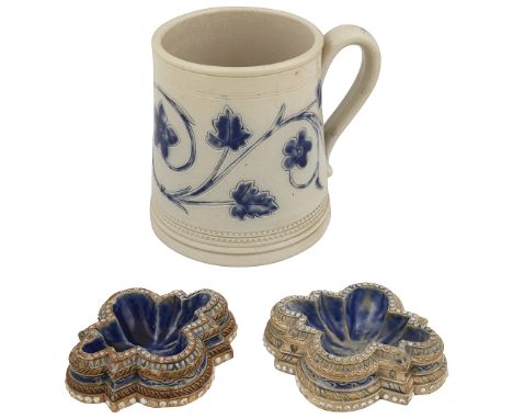 A pair of Doulton Lambeth stoneware table salts and a mugof shaped from, impressed factory marks dated, one incised FAB for F