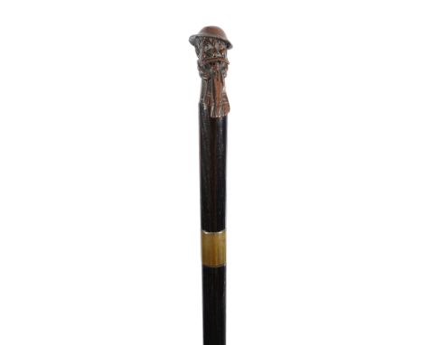 A novelty walking cane/sword stick the handle in the form of a bronzed metal bust of 'Old Bill' signed Bruce Bairnsfather, br