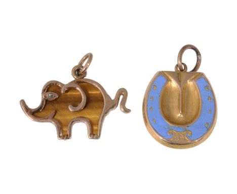Two charms horse shoe locket charm, decorated with pale blue enamel and a 9ct gold and tigers eye elephant charm, stamped wit