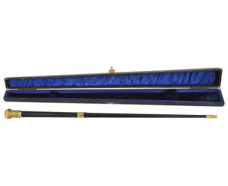An Edwardian cased conductors batonebonised tapering form with foliate gilt mounts, bears inscription 'Presented to Richard M