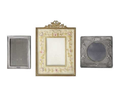 An Edwardian silver Art Nouveau photograph frame and to othersfirst Birmingham, 1903, A &amp; J Zimmerman Ltd, square with ci