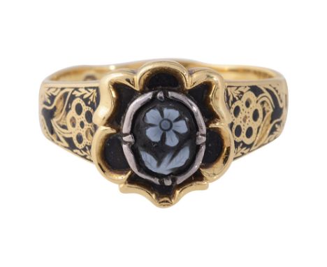 An 18ct yellow gold, agate and black enamel memorial ringthe central silver collet set with a carved  banded agate stylised '