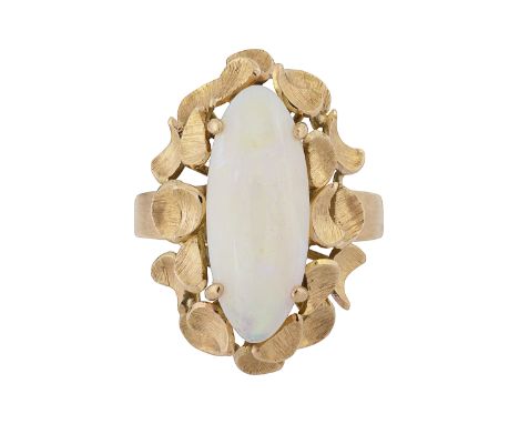 An oval opal ringoval cabochon opal, claw-set raised above an open-work chased foliate border, the basket-setting set to a pl