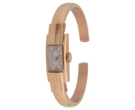 An 18ct gold Ralco manual wind bangle lady's wristwatchthe rectangular dial with alternating raised Arabic and baton numerals