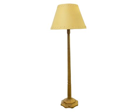 Workshop of Robert Mouseman Thompson (Kilburn). An oak standard lamp octagonal column and base, with craved mouse signature a
