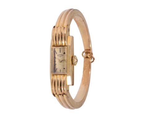 A 1950s lady's 9ct gold Rotary manual wind bangle wristwatchrectangular brushed dial with black hour markers and gold hand si