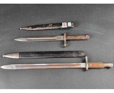A Spanish M1913 sword bayonet and scabbard, stamped 'Arilleria Fca Nacional Toledo', with 40cm blade; together with a Turkish