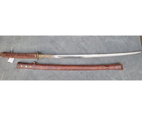 A reproduction Japanese katana and scabbard, having 69cm Damascus blade, overall length 103cm.