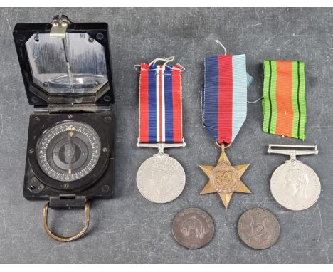 Medals: a WWII group of three, to include: 1939-45 Star; together with a British military Bakelite Mk1 compass; a 1791 Lancas