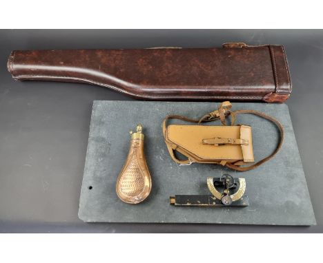 A copper and brass powder flask, 20cm; together with a leg of mutton gun case; and a cased clinometer. 