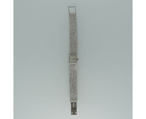 A 9ct white gold lady's Omega bracelet Wristwatch,&nbsp;hallmarked London 1970, the square silvered dial with baton markers, 