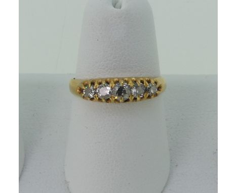 A graduated five stone diamond Ring,&nbsp;the centre stone approx. 0.14ct, all mounted in unmarked yellow hold, tests as 18ct