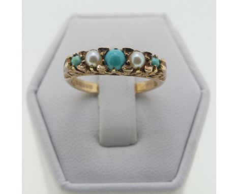 A graduated five stone turquoise and seed pearl Ring, all mounted in 9ct yellow gold, in the antique style with scroll galler