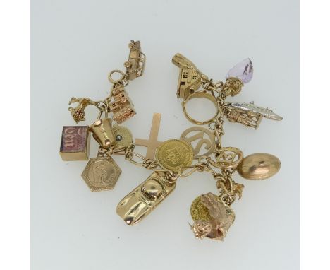 A 9ct yellow gold Charm Bracelet, suspending a George III Third Guinea, dated 1804, a Quarter Guinea, dated 1762, both with s