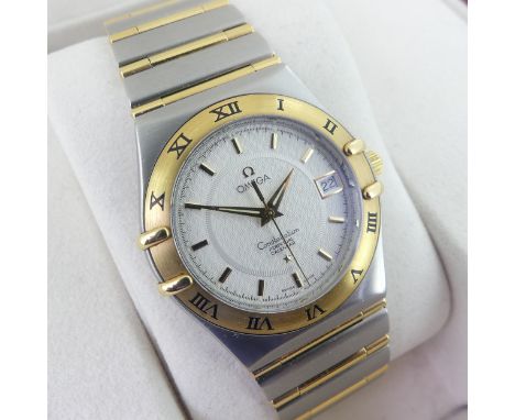 Omega; A gentleman's Constellation perpetual calendar Bi-Metal quartz Wristwatch, cal. 1680, serial no. 57233415, white ename