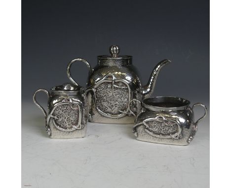 An early 20thC Chinese export silver three piece Tea Set, of cube form with rounded shoulders, hammered body with applied and