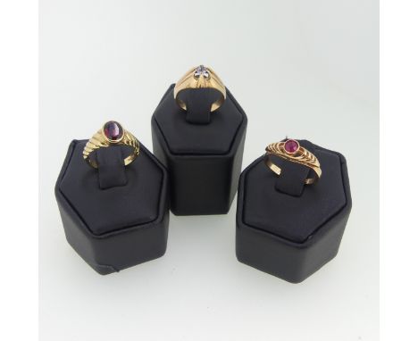 A 9ct yellow gold garnet Ring, the oval facetted stone 7.3mm long collet set with fluted shoulders, Size K½, 2.8g, together w